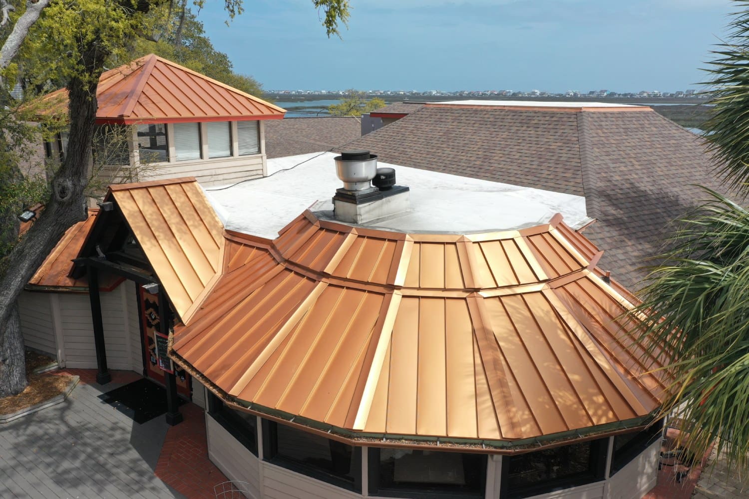 A large building with a roof that has been painted gold.